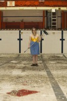 Esther Saussman helps tidy up the pool